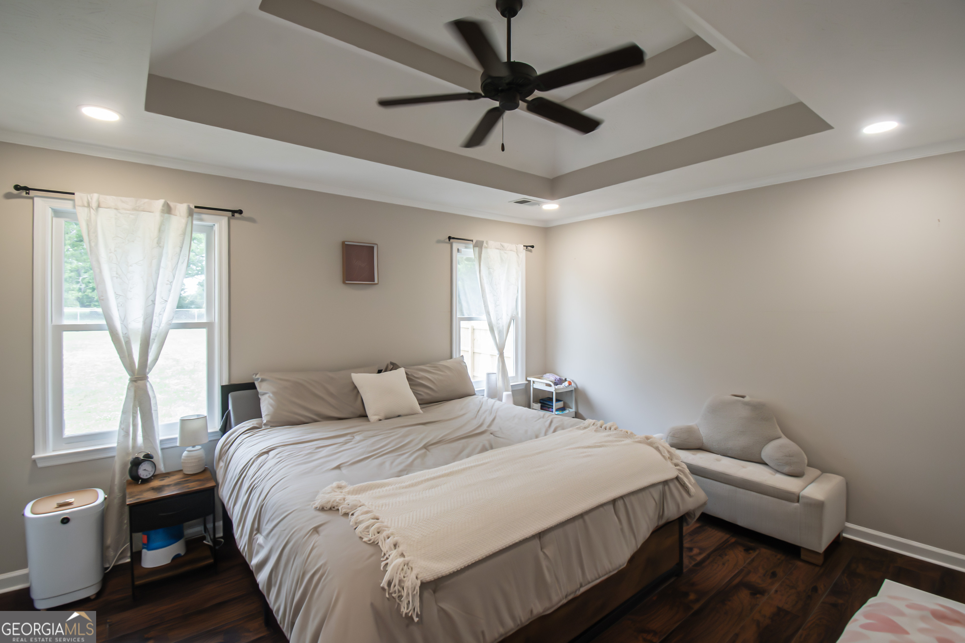 225 Graystone Drive Covington, GA 30014 - Photo 13 of 23 a bedroom with a bed and a ceiling fan