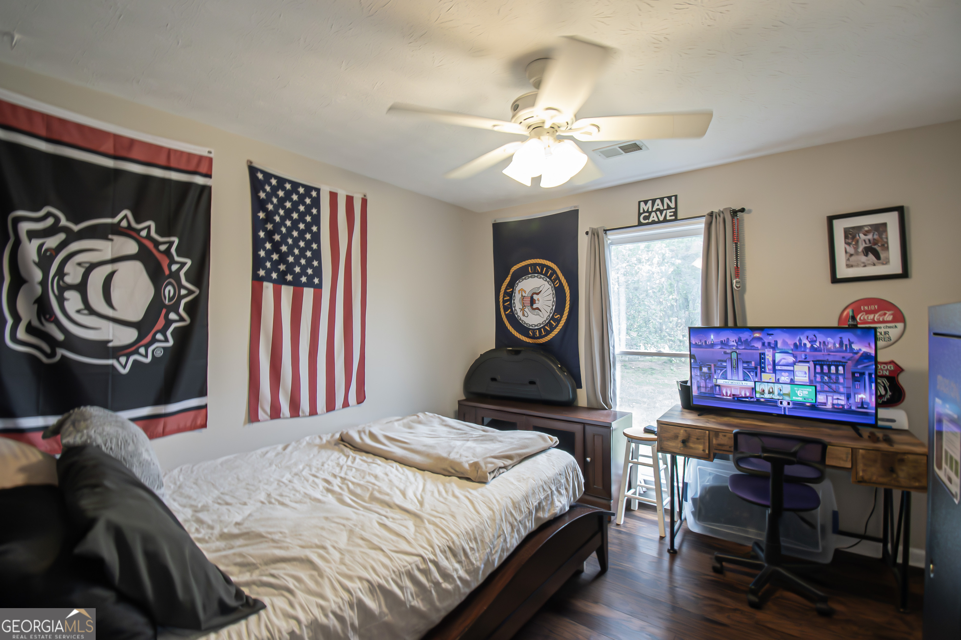 225 Graystone Drive Covington, GA 30014 - Photo 18 of 23 a bedroom with a bed and a chandelier