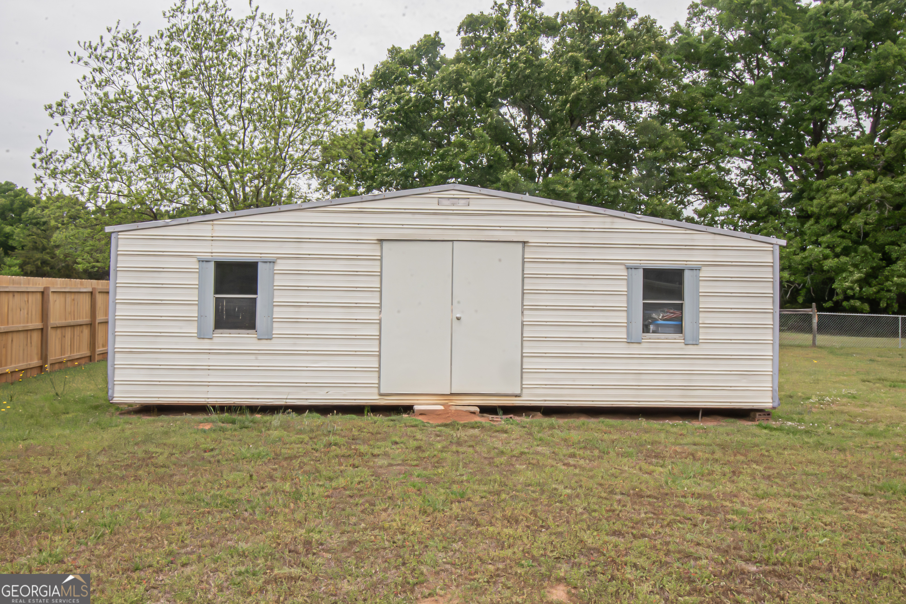 225 Graystone Drive Covington, GA 30014 - Photo 22 of 23 a view of a house with a yard