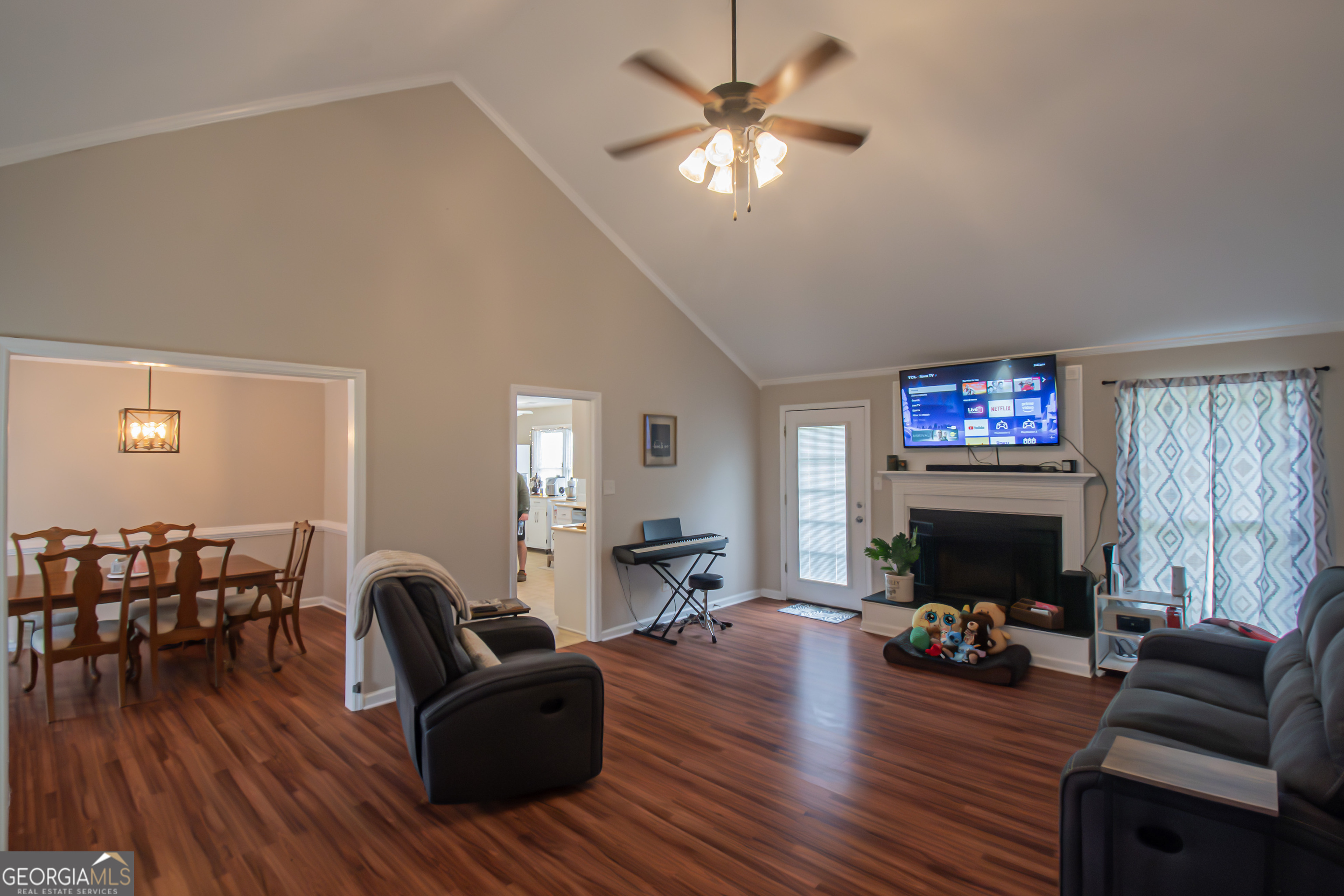 225 Graystone Drive Covington, GA 30014 - Photo 5 of 23 a living room with furniture and a flat screen tv