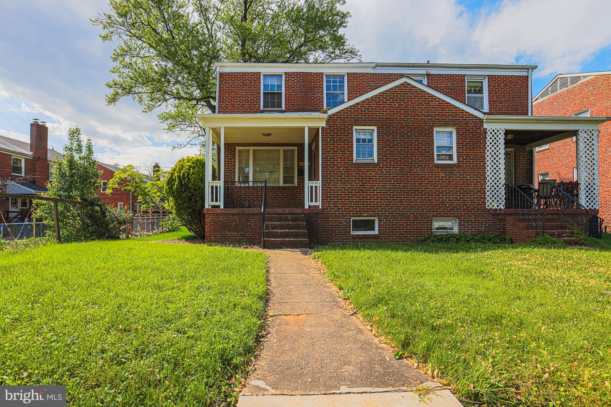 3914 Bancroft Road Baltimore, MD 21215 - Photo 2 of 25 a front view of a house with garden