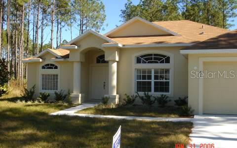 61 Riviere Lane Palm Coast, FL 32164 - Photo 1 of 1 a front view of a house
