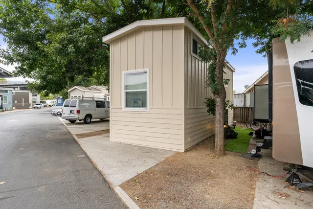 a white house that has a sign on the side of it