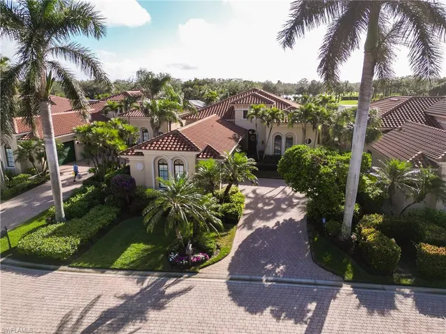 a view of a street with a palm trees