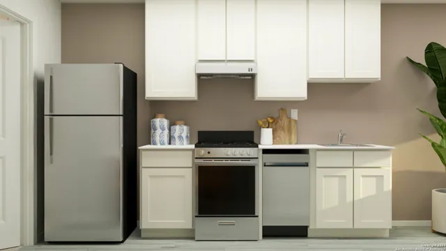 a kitchen with stainless steel appliances granite countertop a refrigerator stove a sink and dishwasher