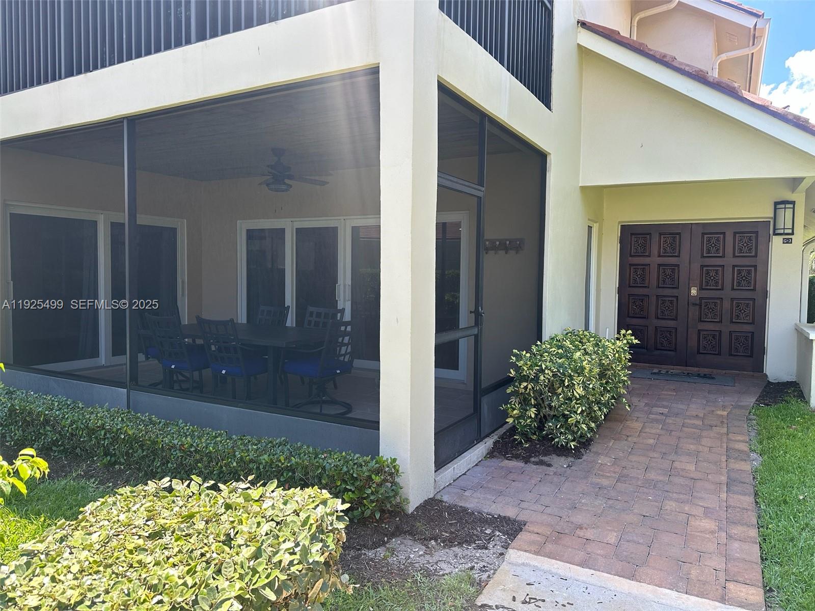 4161 South Us Highway, Unit G2 Jupiter, FL 33477 - Photo 12 of 62 a view of a backyard with potted plants