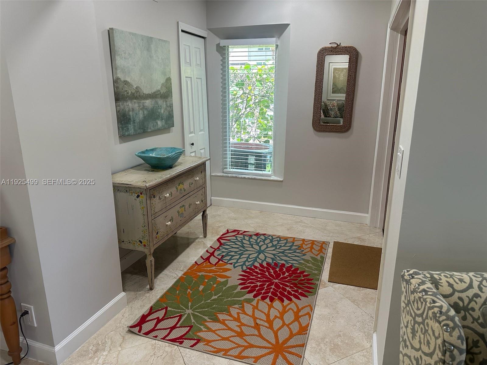 4161 South Us Highway, Unit G2 Jupiter, FL 33477 - Photo 19 of 62 a bedroom with a bed and a window