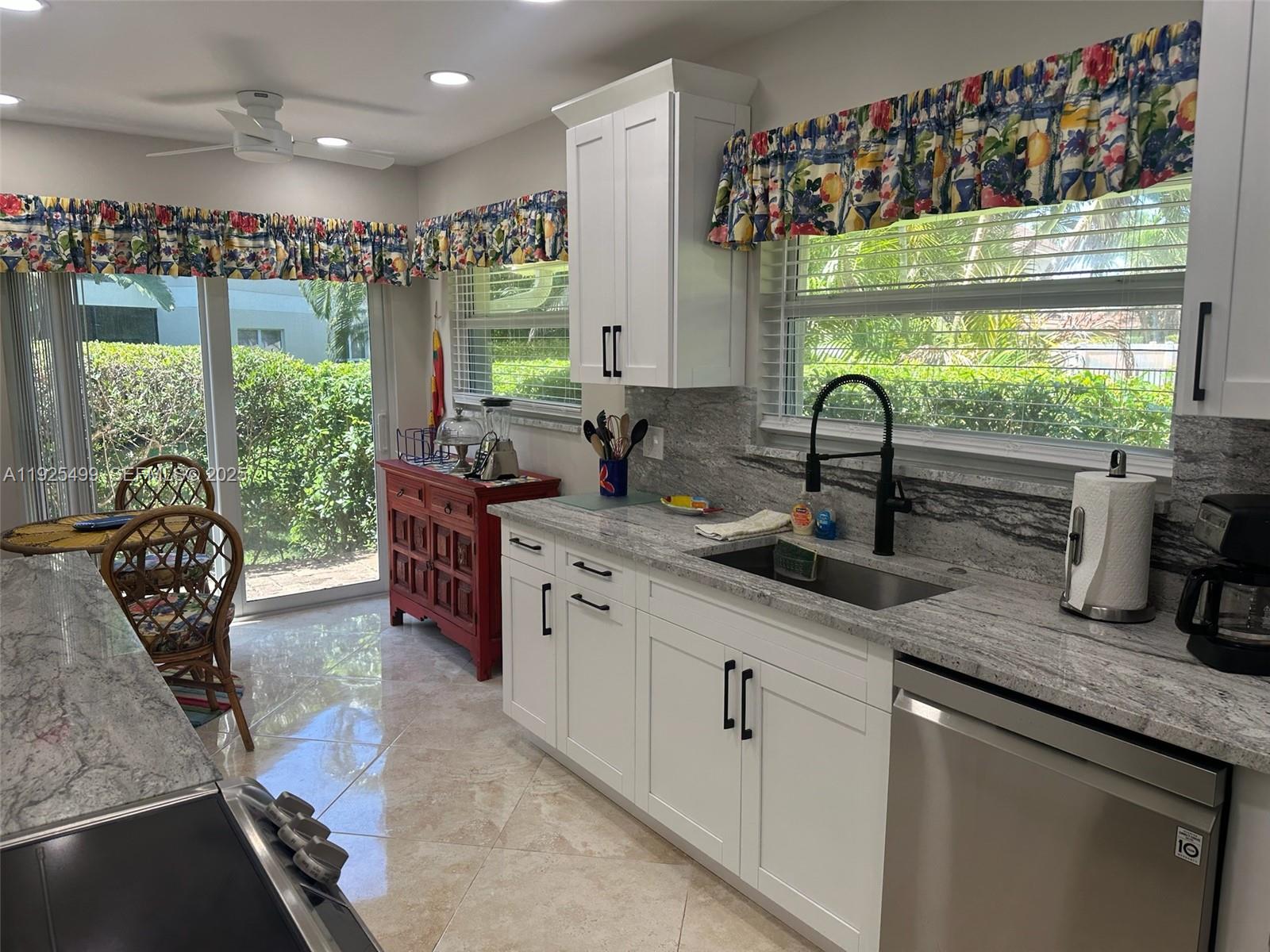 4161 South Us Highway, Unit G2 Jupiter, FL 33477 - Photo 24 of 62 a kitchen with lots of counter top space and a large window