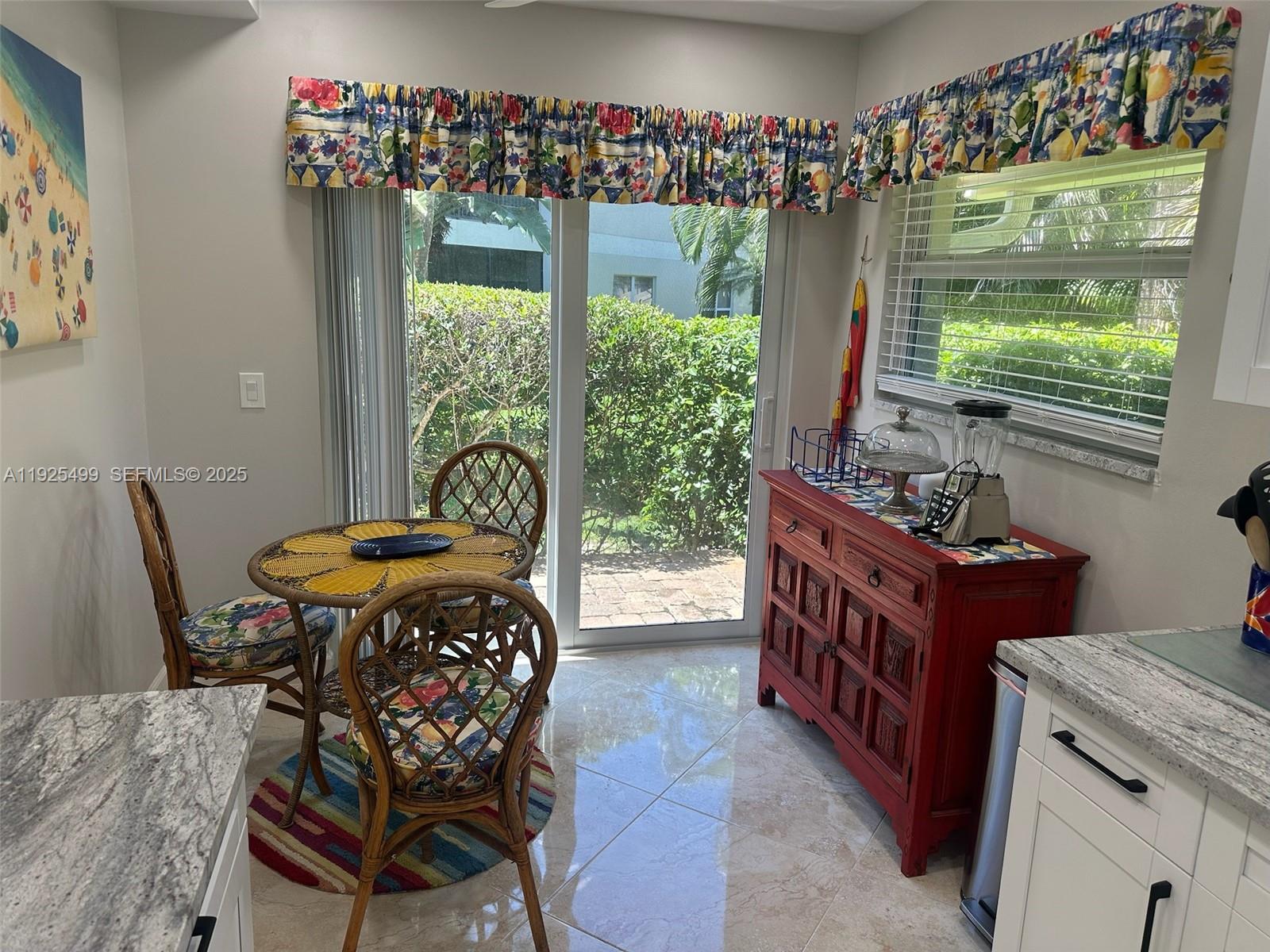 4161 South Us Highway, Unit G2 Jupiter, FL 33477 - Photo 25 of 62 a living room with furniture and a window