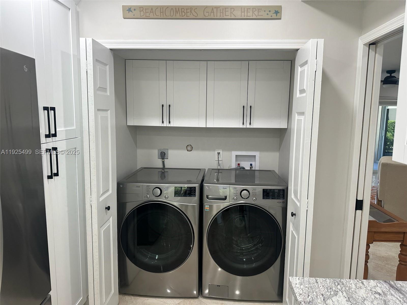4161 South Us Highway, Unit G2 Jupiter, FL 33477 - Photo 29 of 62 a utility room with dryer and washer