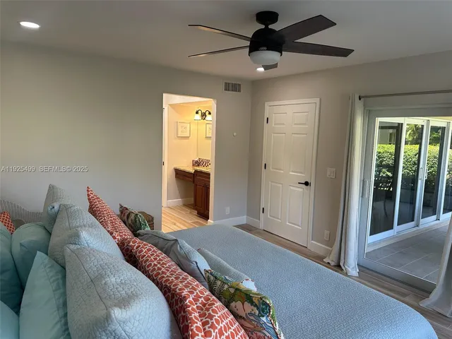 a bedroom with a bed and a mirror