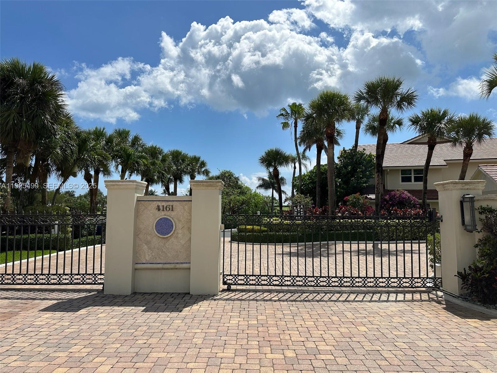 4161 South Us Highway, Unit G2 Jupiter, FL 33477 - Photo 4 of 62 a white house with trees in front of it