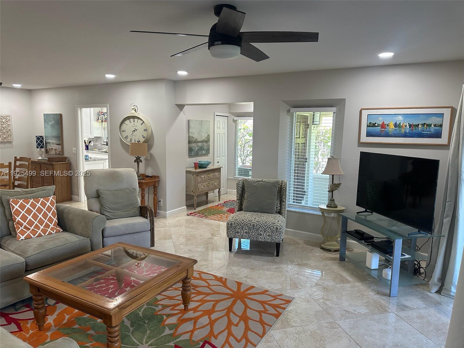 4161 South Us Highway, Unit G2 Jupiter, FL 33477 - Photo 48 of 62 a living room with furniture and a flat screen tv