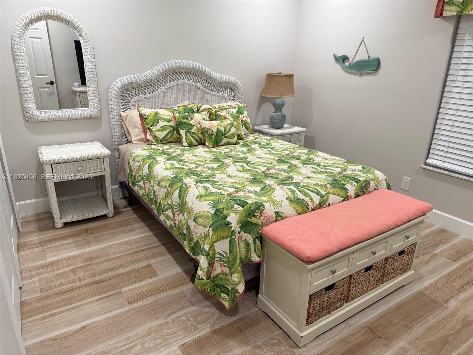 4161 South Us Highway, Unit G2 Jupiter, FL 33477 - Photo 50 of 62 a bedroom with a bed and a mirror