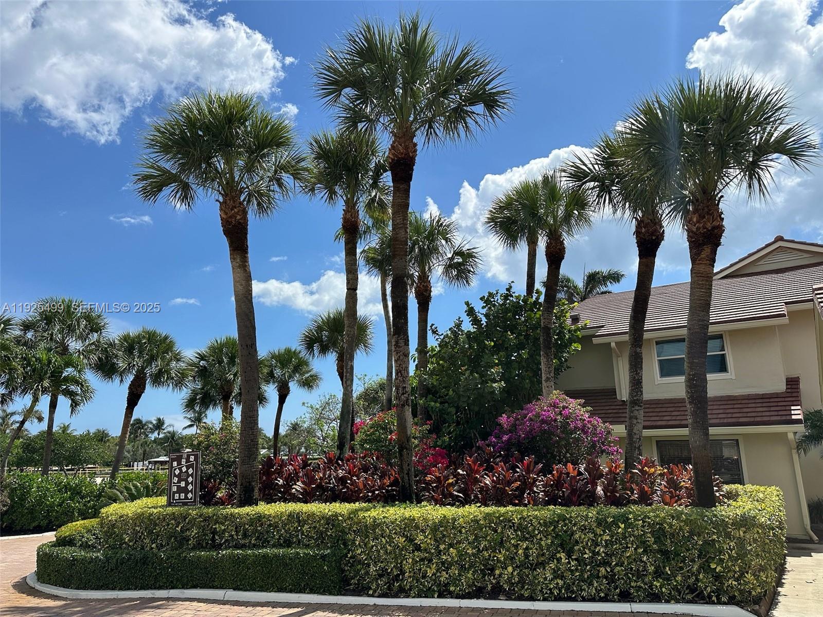 4161 South Us Highway, Unit G2 Jupiter, FL 33477 - Photo 5 of 62 a view of a yard with a palm trees