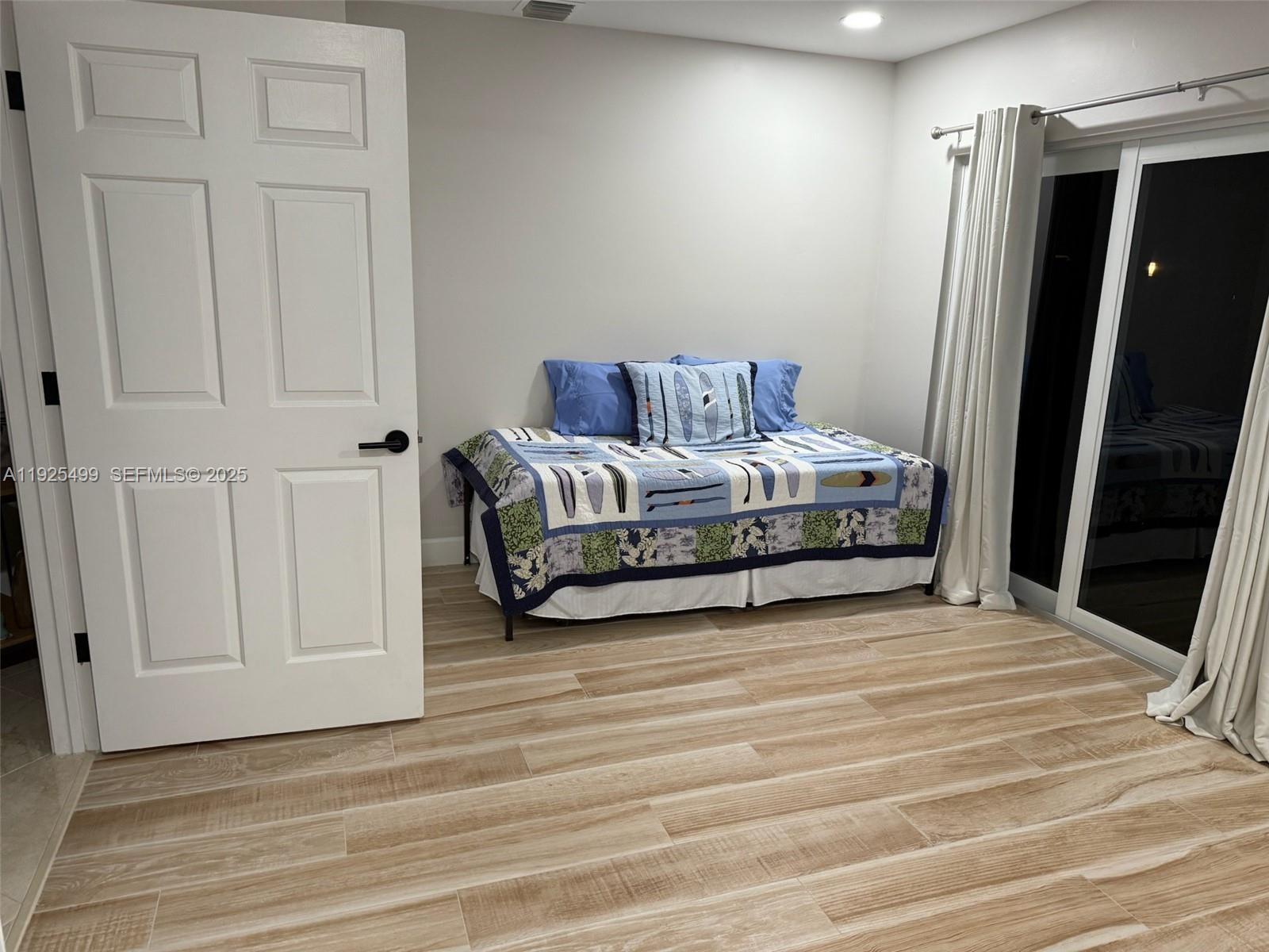 4161 South Us Highway, Unit G2 Jupiter, FL 33477 - Photo 56 of 62 a spacious bedroom with a bed and a walk in closet