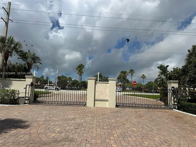 a view of a backyard with potted plants