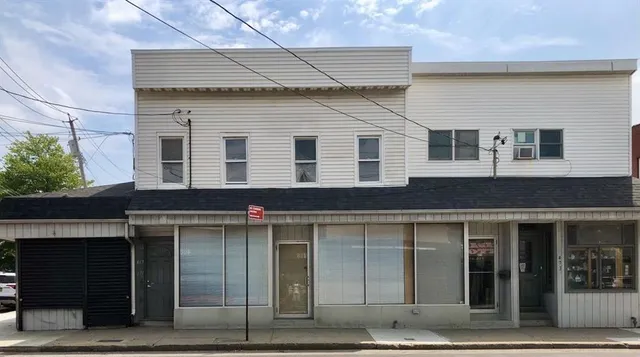 a view of a house with a parking space