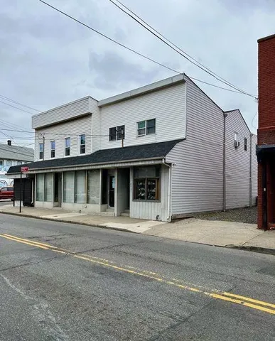 a front view of a house with a garage