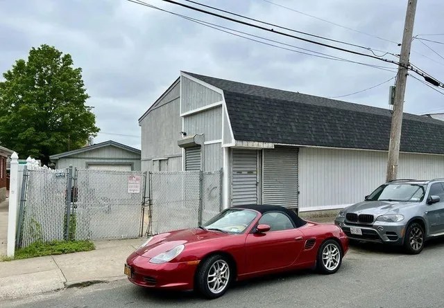 a car parked in front of a house