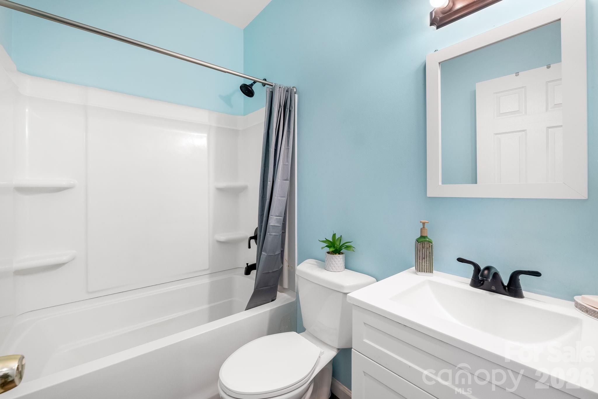 845 Spindale Street Spindale, NC 28160 - Photo 14 of 27 a bathroom with a sink toilet and shower
