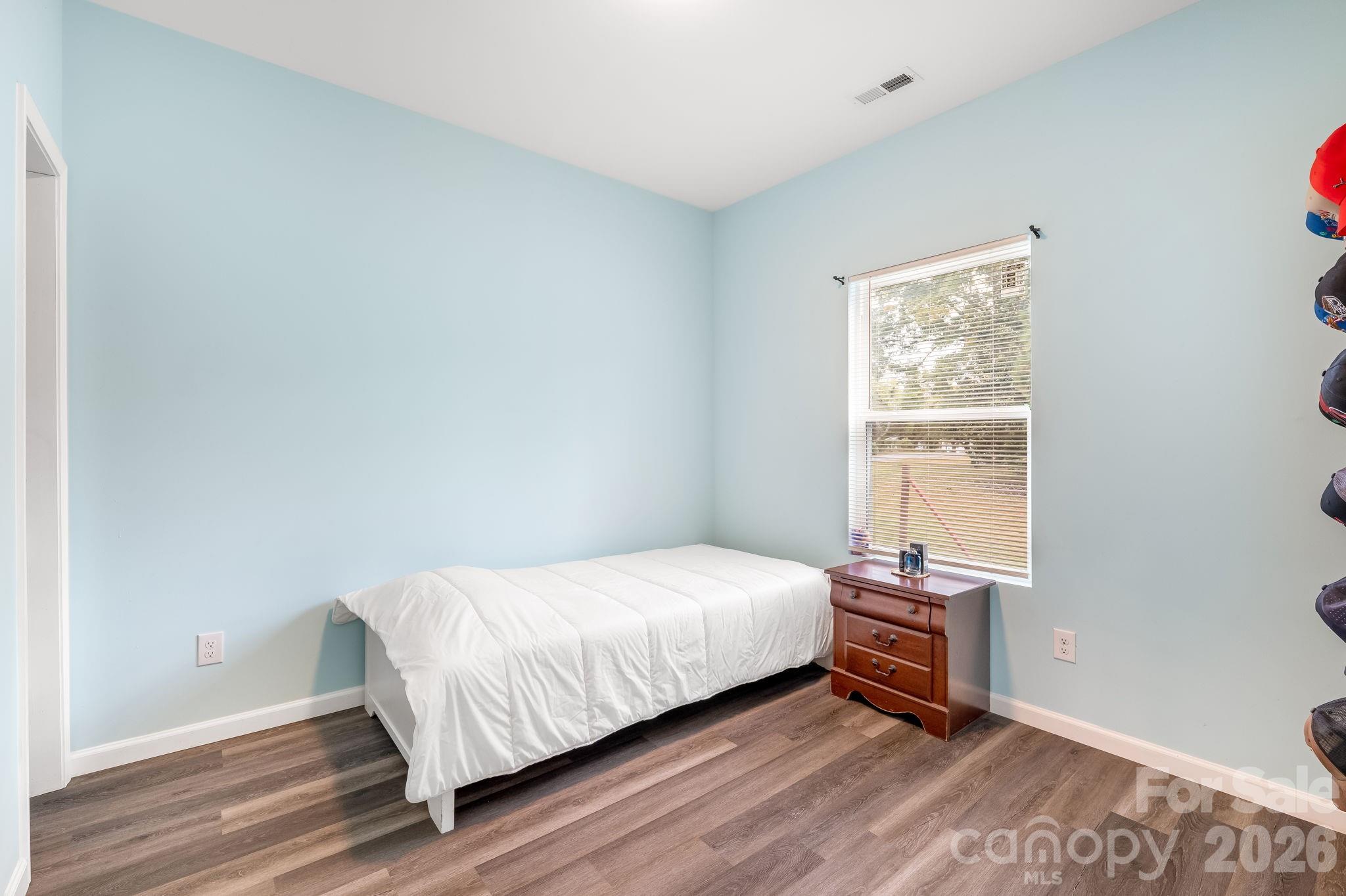 845 Spindale Street Spindale, NC 28160 - Photo 16 of 27 a bedroom with a bed and a window