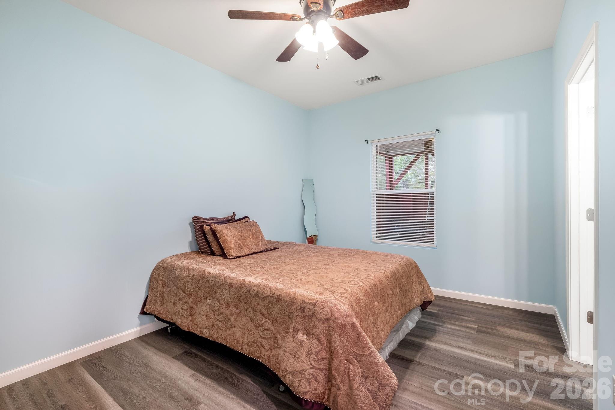 845 Spindale Street Spindale, NC 28160 - Photo 18 of 27 a bedroom with a bed and window