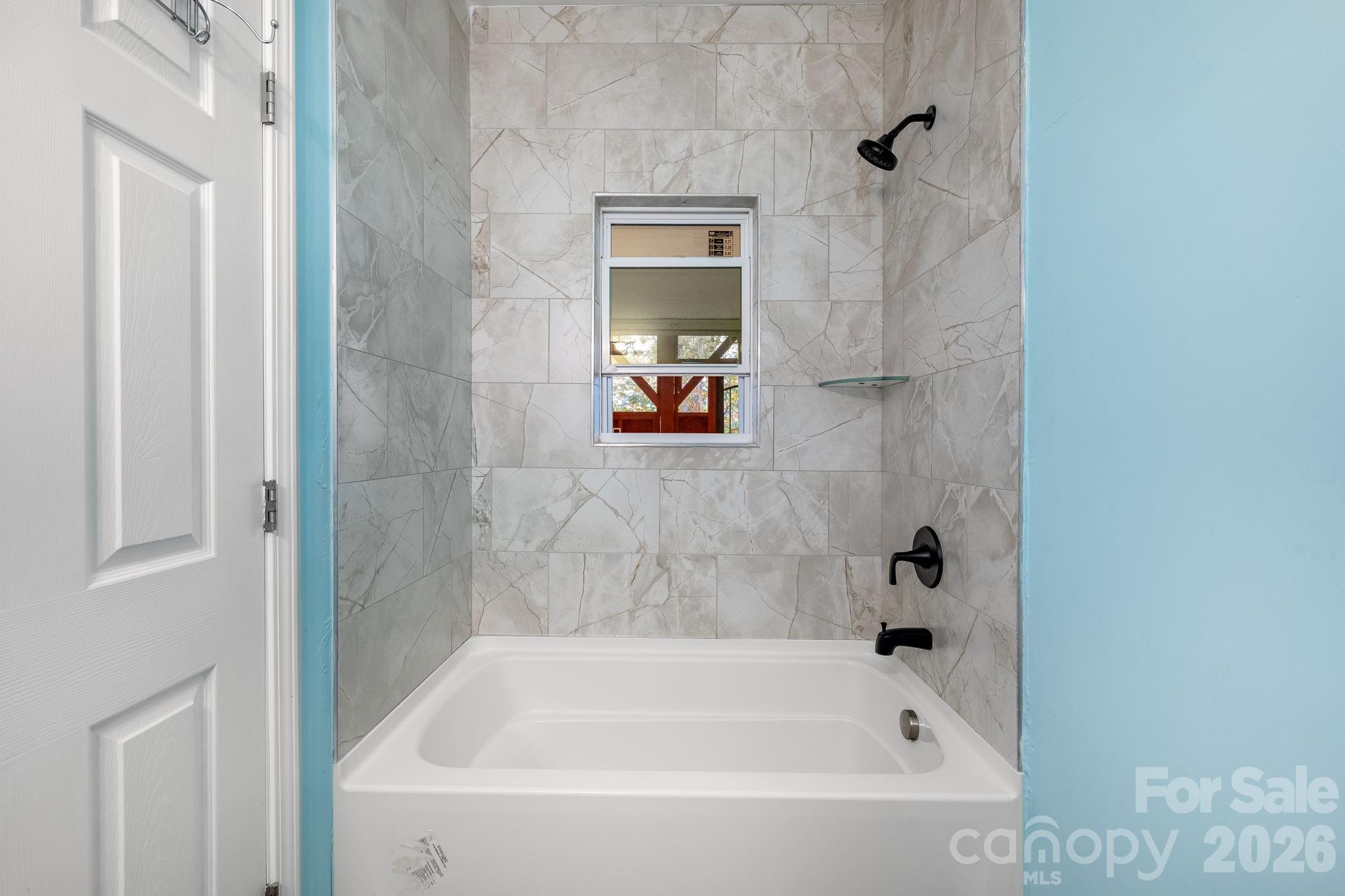 845 Spindale Street Spindale, NC 28160 - Photo 21 of 27 a bathroom with a bathtub