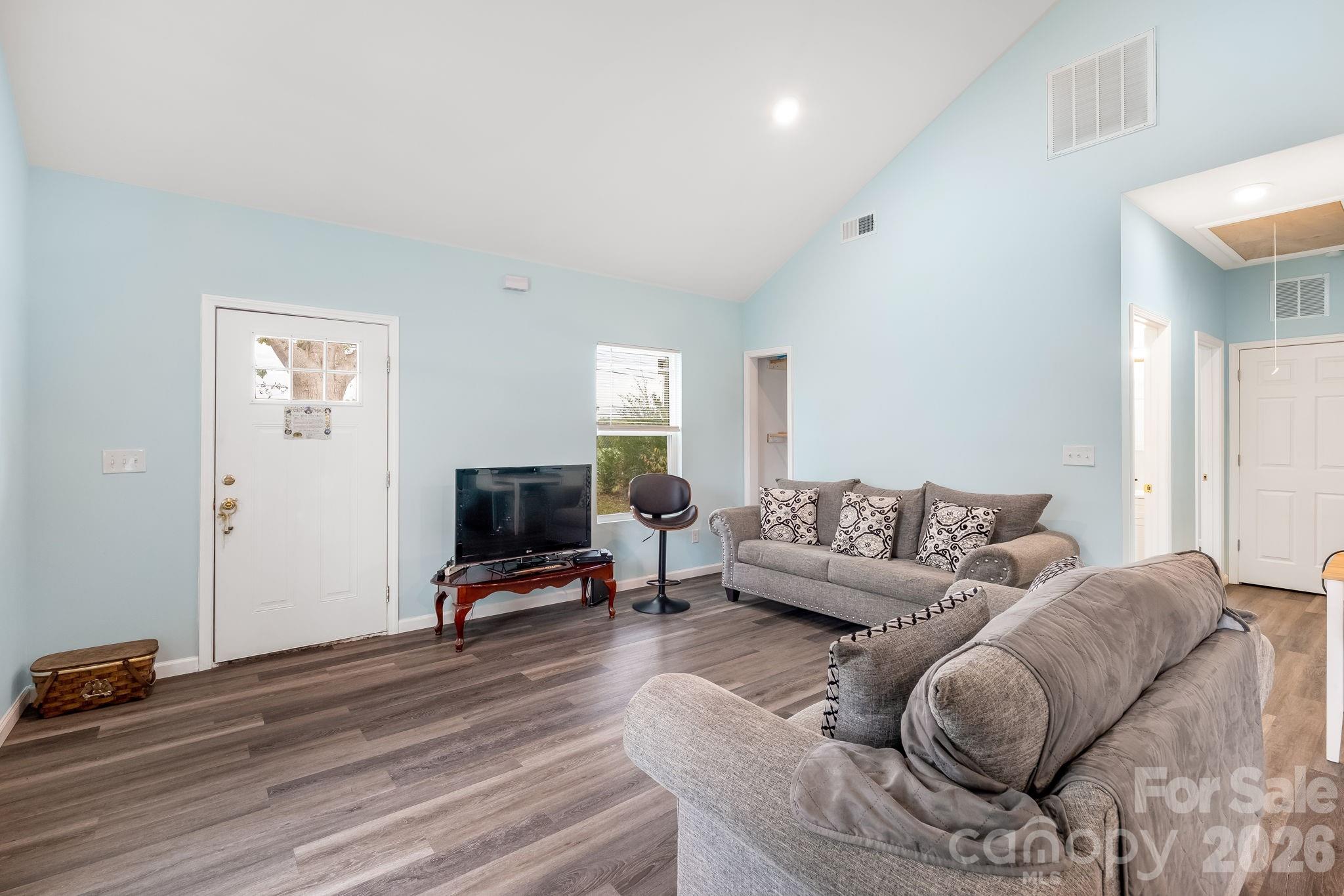 845 Spindale Street Spindale, NC 28160 - Photo 7 of 27 a living room with furniture flat screen tv and a wooden floor