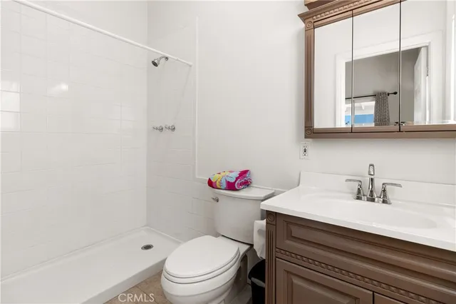a view of game room with window and book shelf