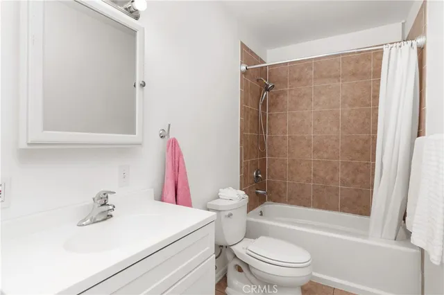 a view of a porch with furniture and floor to ceiling window
