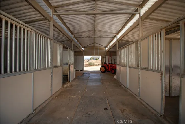 a bedroom with a bed and a mirror