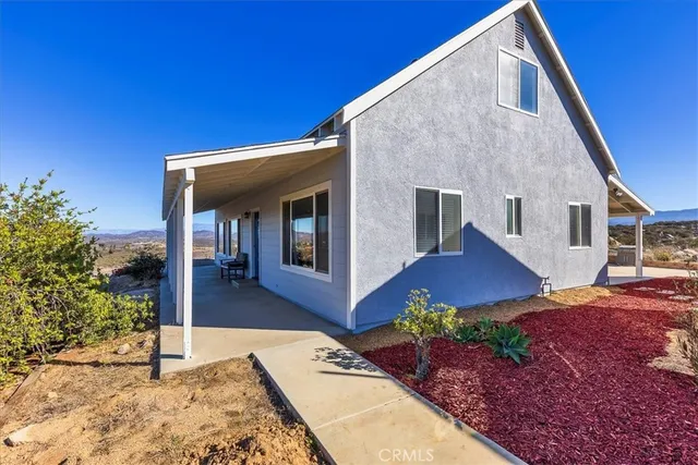 a bathroom with a sink a mirror and a window
