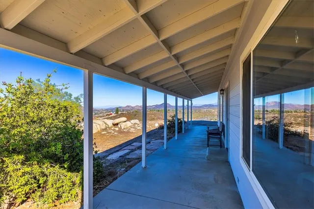 a bedroom with a bed dresser and a window