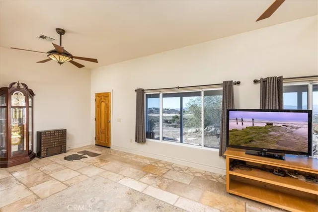 a view of livingroom with furniture and windows
