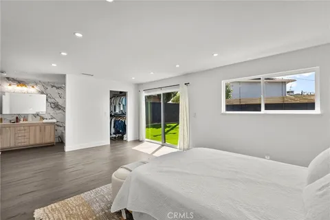 a view of a livingroom with furniture and a flat screen tv