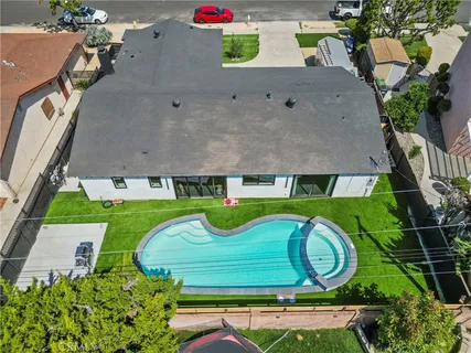 an aerial view of a house with garden space fireplace and outdoor seating
