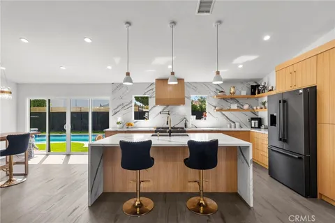 a kitchen with counter top space cabinets and stainless steel appliances