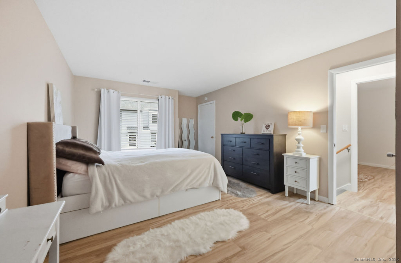 39 Cottonwood Road, Unit 39 Newington, CT 06111 - Photo 12 of 21 a bedroom with a bed and furniture