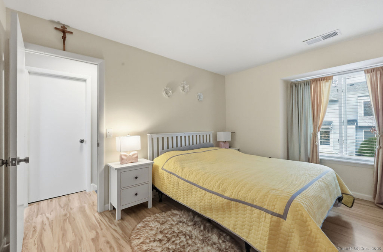 39 Cottonwood Road, Unit 39 Newington, CT 06111 - Photo 15 of 21 a bedroom with a bed and a window