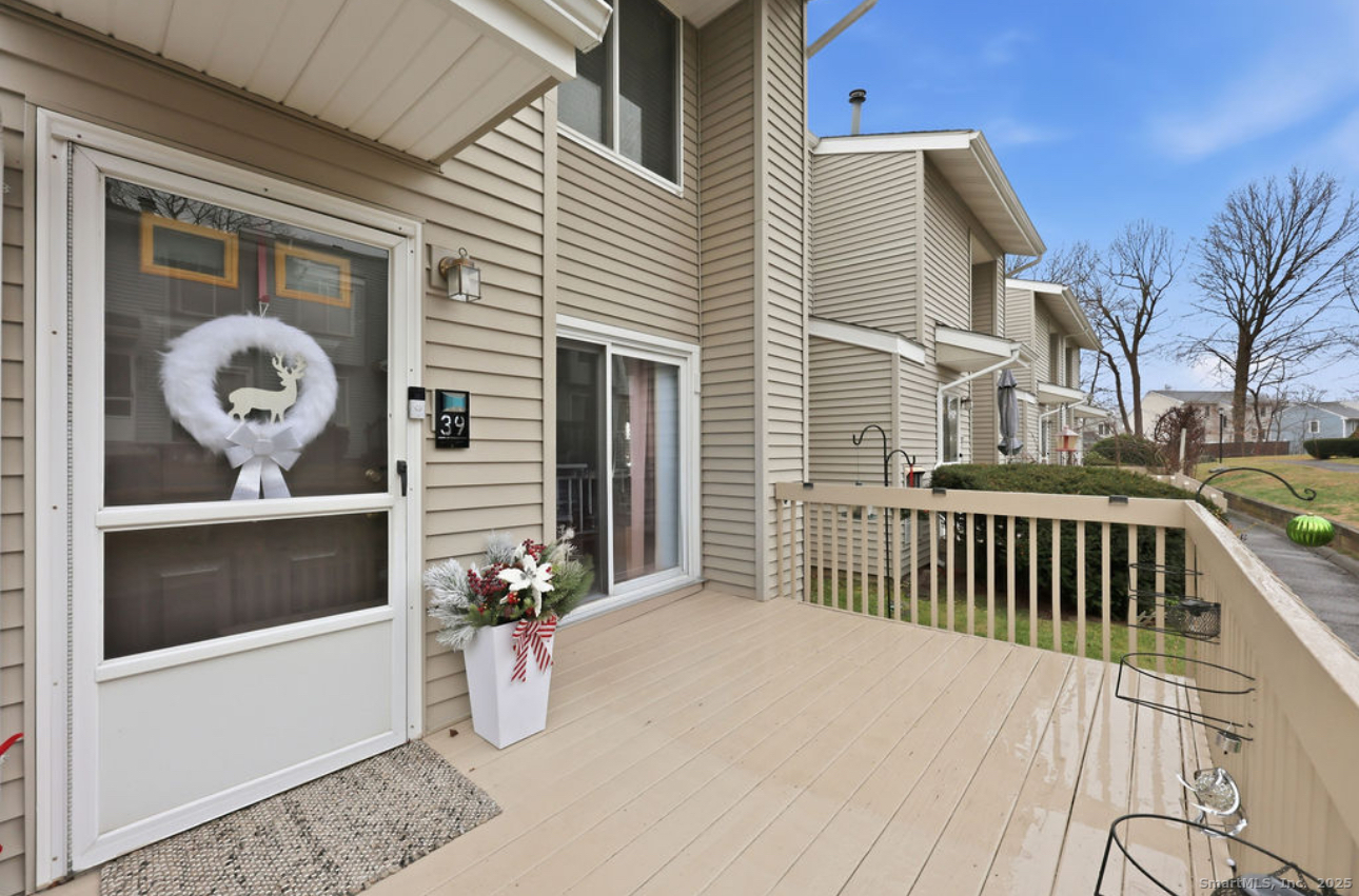 39 Cottonwood Road, Unit 39 Newington, CT 06111 - Photo 16 of 21 a view of a deck with a barbeque grill and potted plants