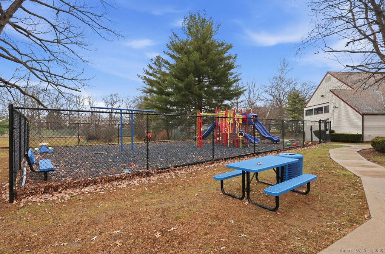 39 Cottonwood Road, Unit 39 Newington, CT 06111 - Photo 17 of 21 a park view with a bench
