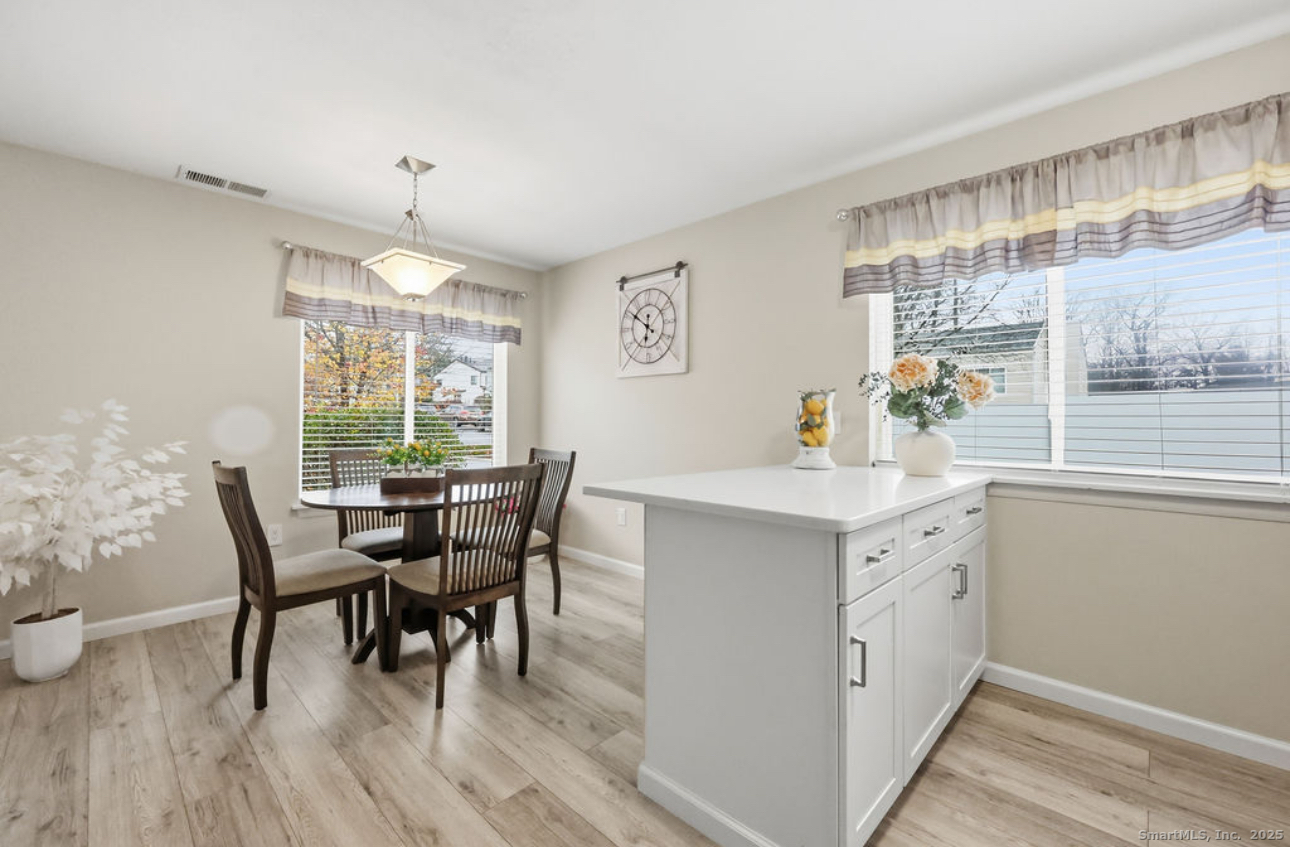 39 Cottonwood Road, Unit 39 Newington, CT 06111 - Photo 6 of 21 a view of a dining room with furniture window and outside view