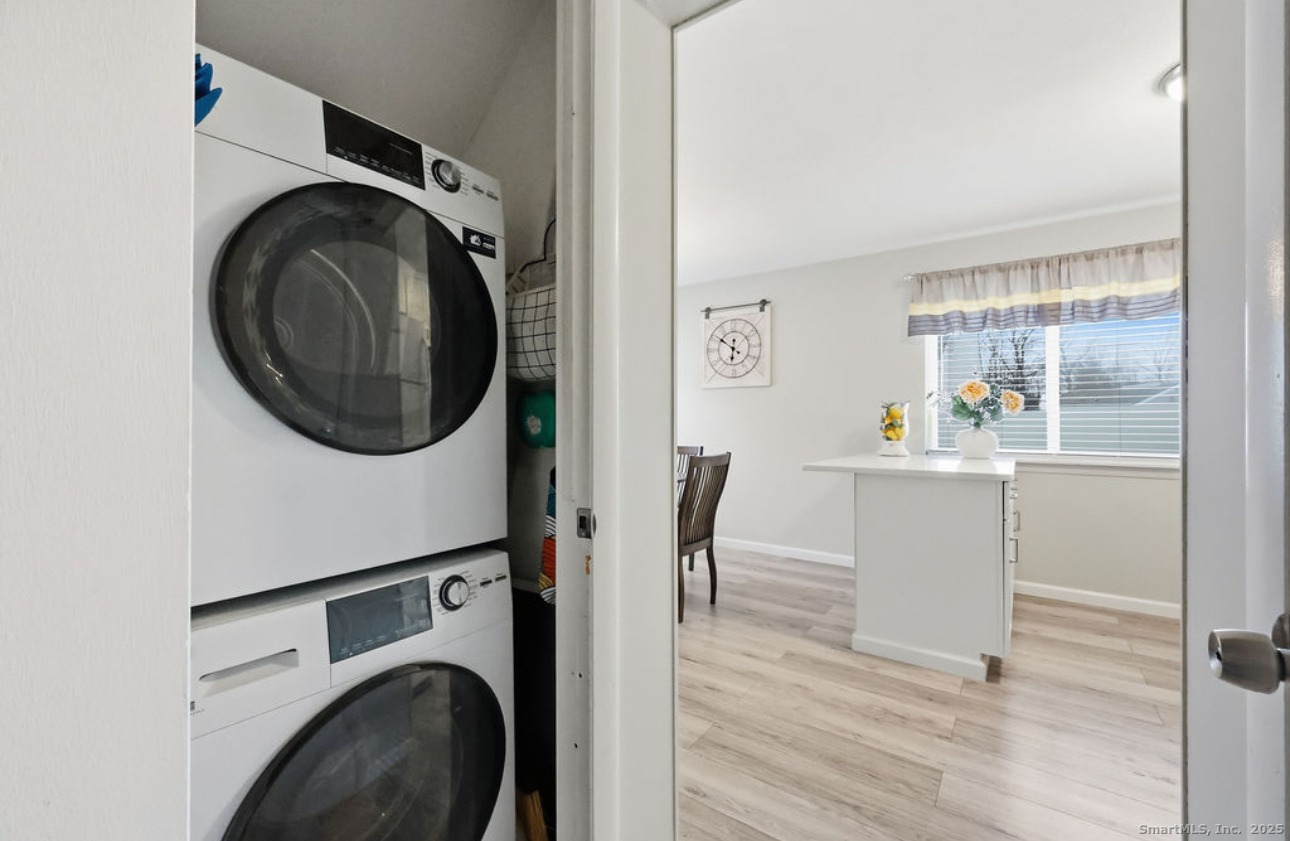 39 Cottonwood Road, Unit 39 Newington, CT 06111 - Photo 8 of 21 a view of a storage & utility room with washer and dryer