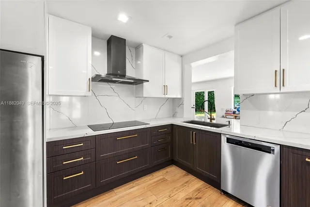 a kitchen with a sink and cabinets