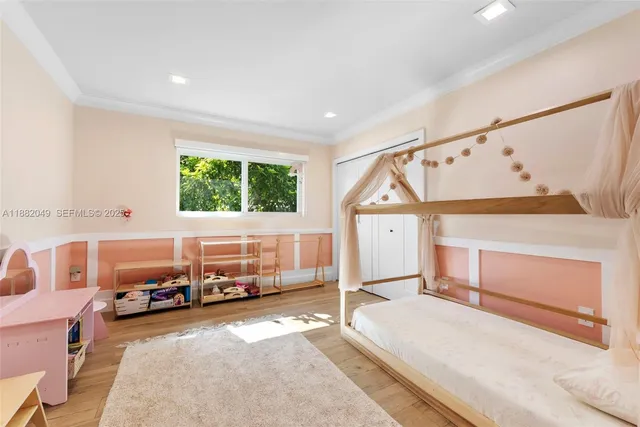 a bedroom with furniture and a window