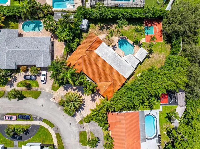 an aerial view of a house with a lake view