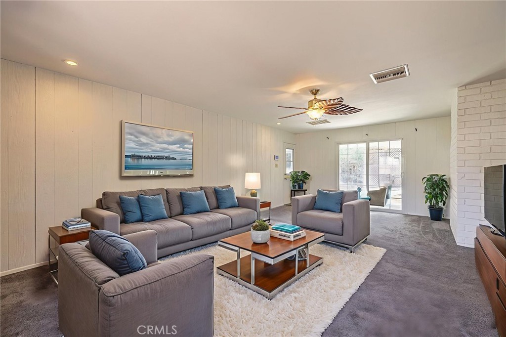 44916 18th Street West Lancaster, CA 93534 - Photo 13 of 32 a living room with furniture and a large window