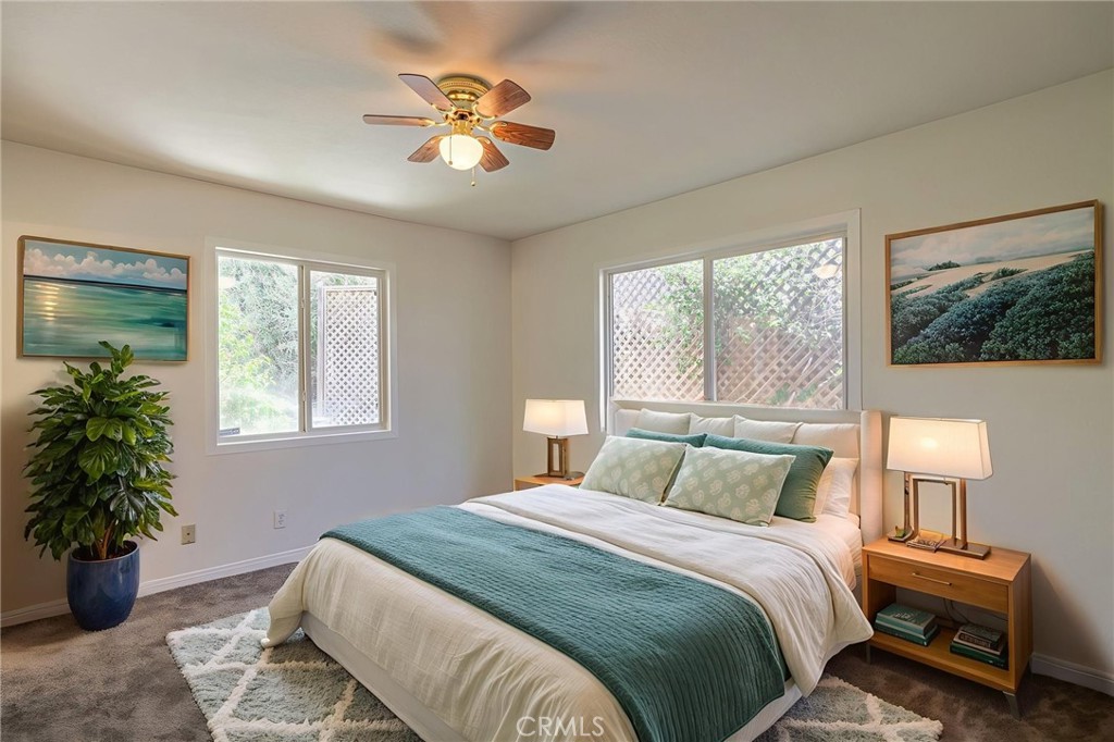 44916 18th Street West Lancaster, CA 93534 - Photo 15 of 32 a bedroom with a large bed and a window