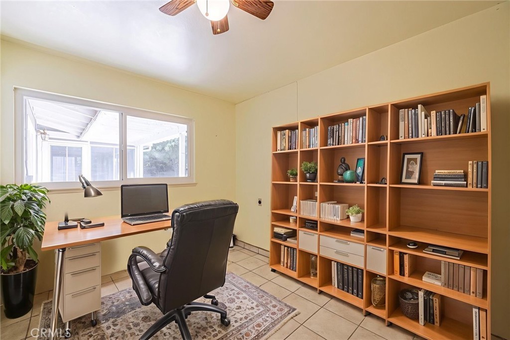 44916 18th Street West Lancaster, CA 93534 - Photo 18 of 32 a view of a workspace with furniture and a window